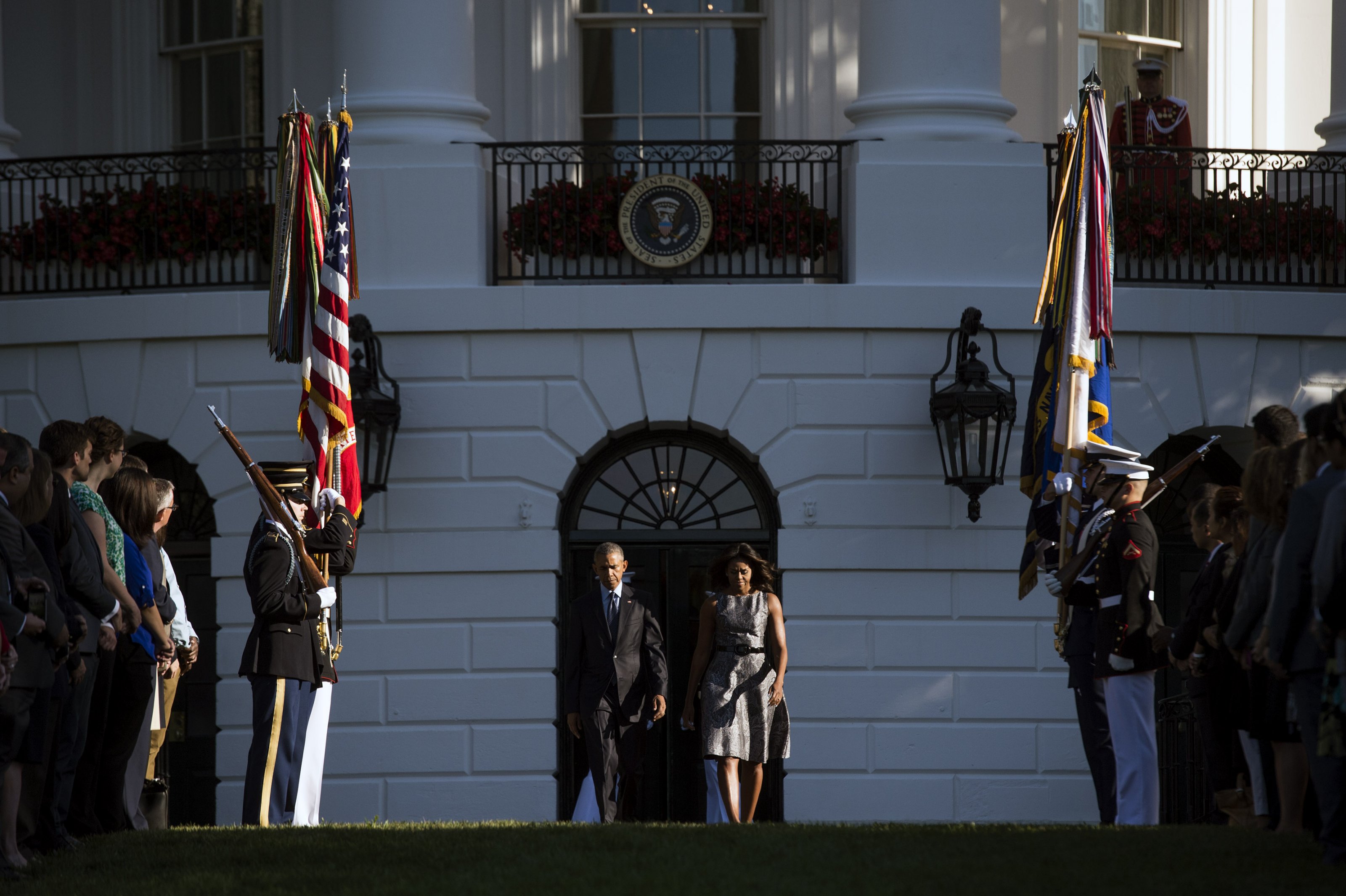 President Barack Obama and First Lady Michelle Obama walk onto the South Lawn to participate in a moment of silence for the 14th anniversary of the September 11 terrorist attacks on the United States, at the White House in Washington, D.C. on September 11, 2015. Photo by Kevin Dietsch/UPI/ABACAPRESS.COM