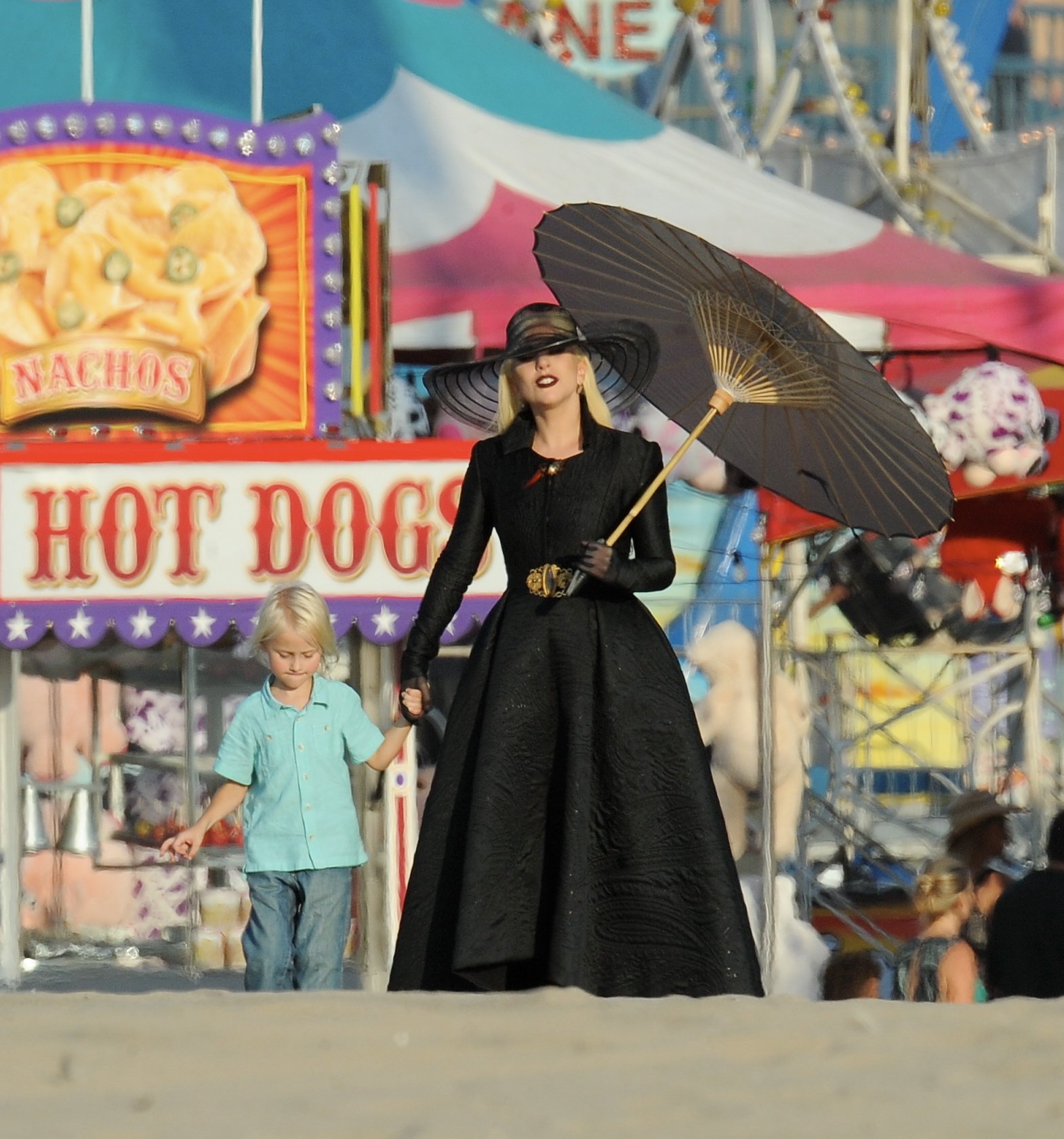 Countness Lady Gaga dress in all black for a beach carnival scene in Santa Monica for "American Horror Story Hotel" with co star Wes Bentley. The singer walk around the sand with black heels in a scorching hot day but had help with umbrellas and water fan for the crew.

Featuring: Lady Gaga
Where: Santa Monica, California, United States
When: 10 Sep 2015
Credit: Cousart/JFXimages/WENN.com
Countness Lady Gaga dress in all black for a beach carnival scene in Santa Monica for "American Horror Story Hotel" with co star Wes Bentley. The singer walk around the sand with black heels in a scorching hot day but had help with umbrellas and water fan for the crew.

Featuring: Lady Gaga
Where: Santa Monica, California, United States
When: 10 Sep 2015
Credit: Cousart/JFXimages/WENN.com