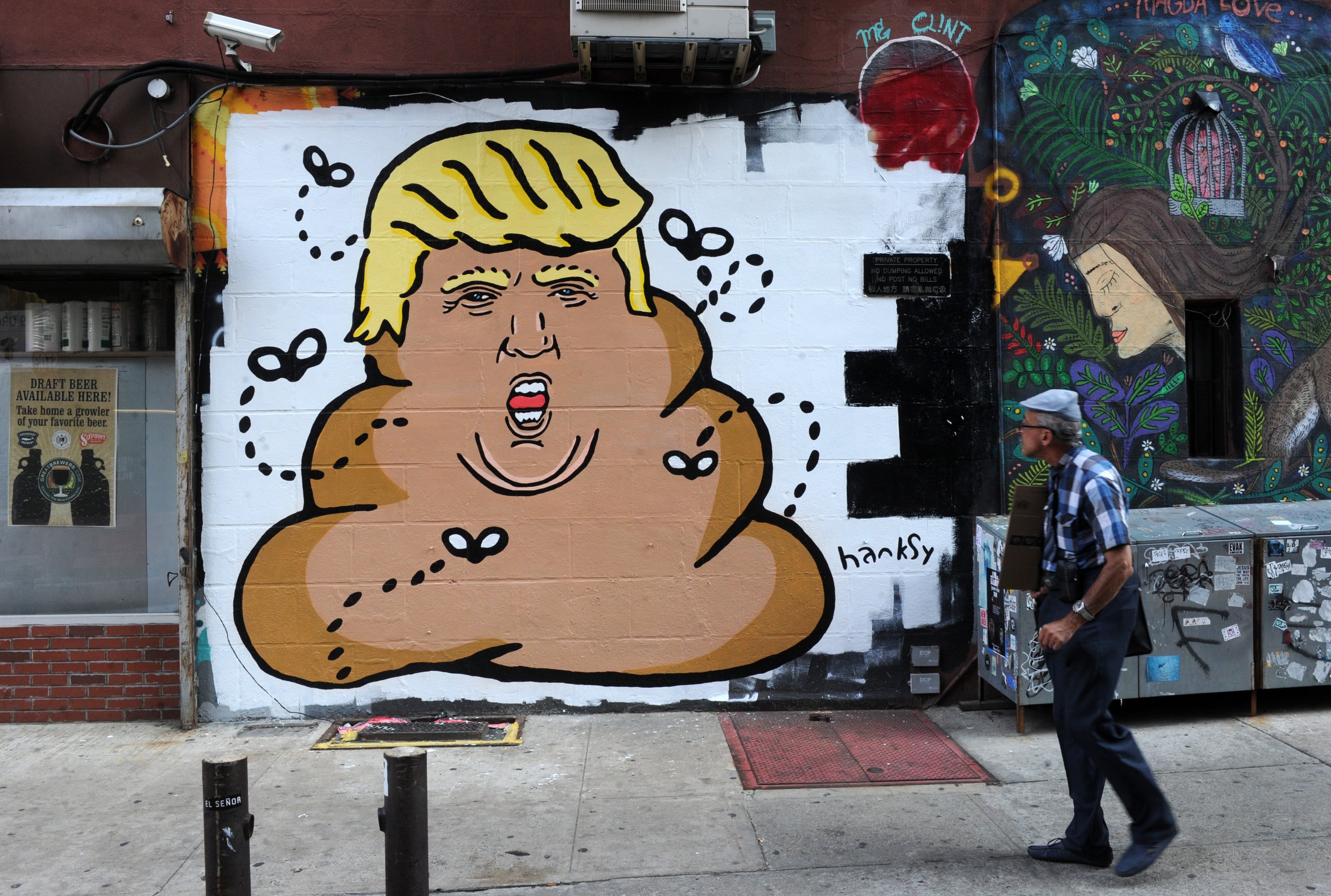 A new Lower East Side mural by the anonymous painter and pun lover depicts the Republican presidential hopeful Donald Trump as a pile of poop crowned with lemon-yellow hair and circled by flies. New York City, NY, USA, September 3, 2015. Photo by Dennis Van Tine/ABACAPRESS.COM
